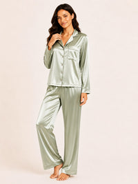 Woman wearing a green satin pajama set on a beige background