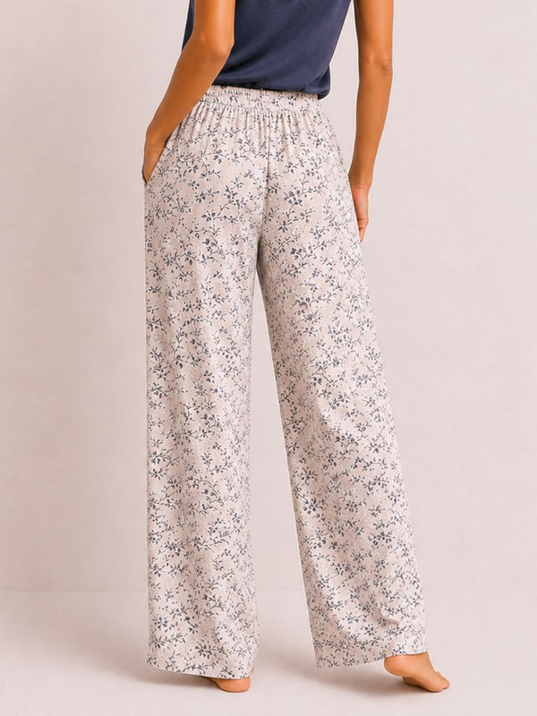 Floral-patterned wide-leg pants worn by a person on a plain background