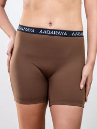 Brown boxer briefs with a visible brand logo on a plain background
