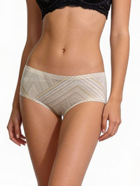Beige patterned underwear worn by a person on a white background