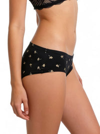 Black underwear with gold floral patterns on a white background