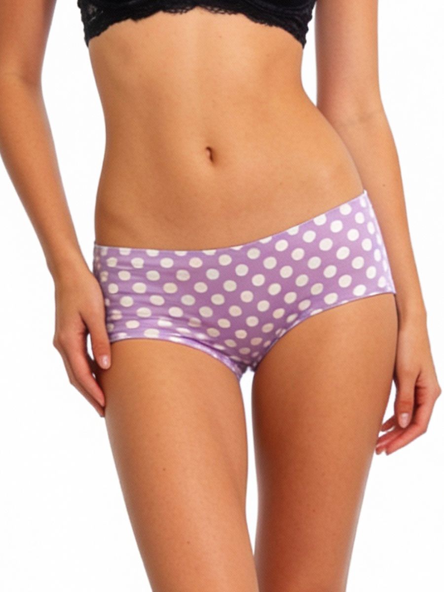 Purple polka dot underwear worn by a person on a white background