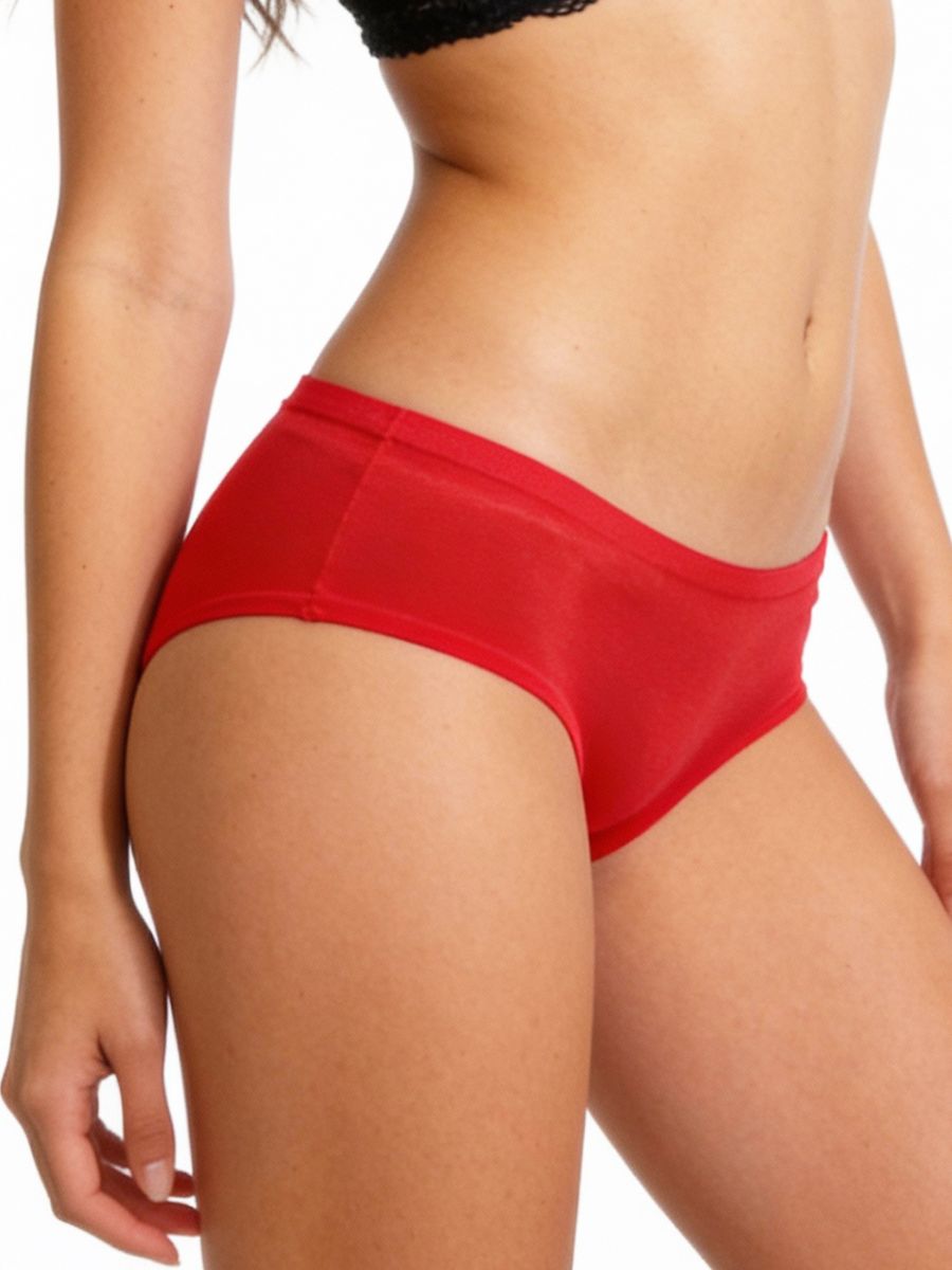 Red underwear worn by a person on a white background