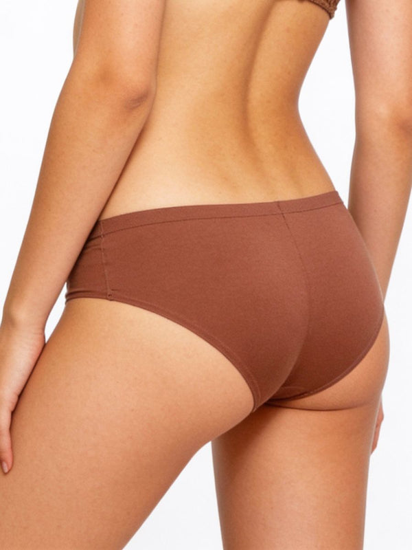 Brown underwear worn by a person on a white background