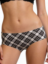 Black and white plaid bikini bottom worn by a person on a plain background