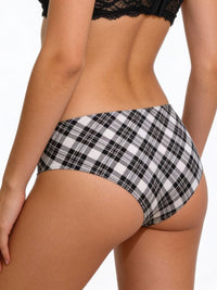 Plaid patterned underwear worn by a person on a white background