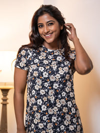 Woman wearing a floral dress with a blurred background