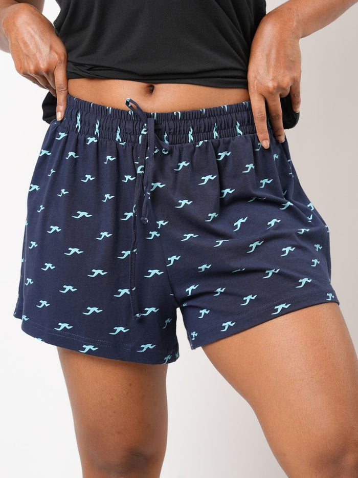 Navy shorts with a blue pattern worn by a person on a plain background
