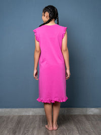 Person wearing a Magenta dress with ruffled sleeves and hem 