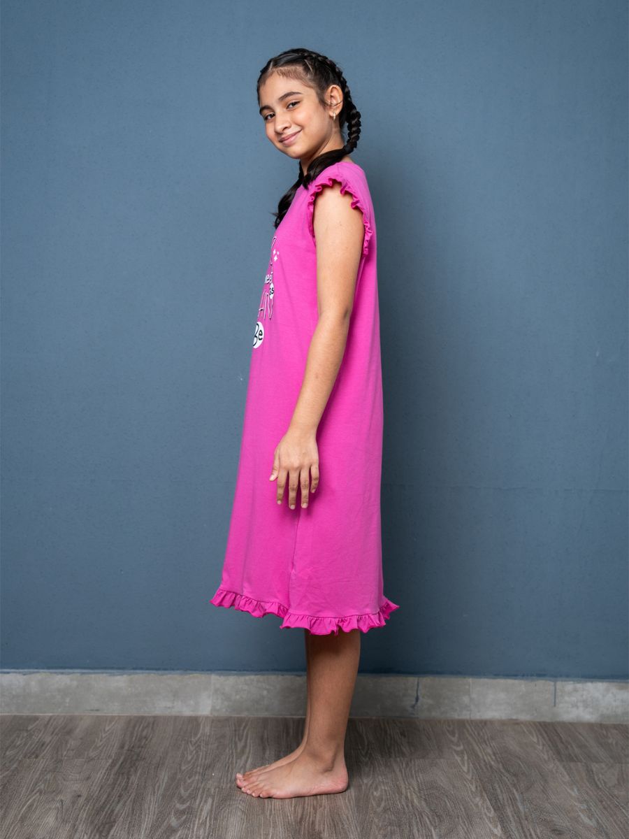 Young girl wearing a magenta dress 