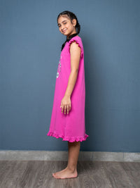 Young girl wearing a magenta dress 