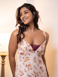 Woman wearing a floral dress with a blurred background