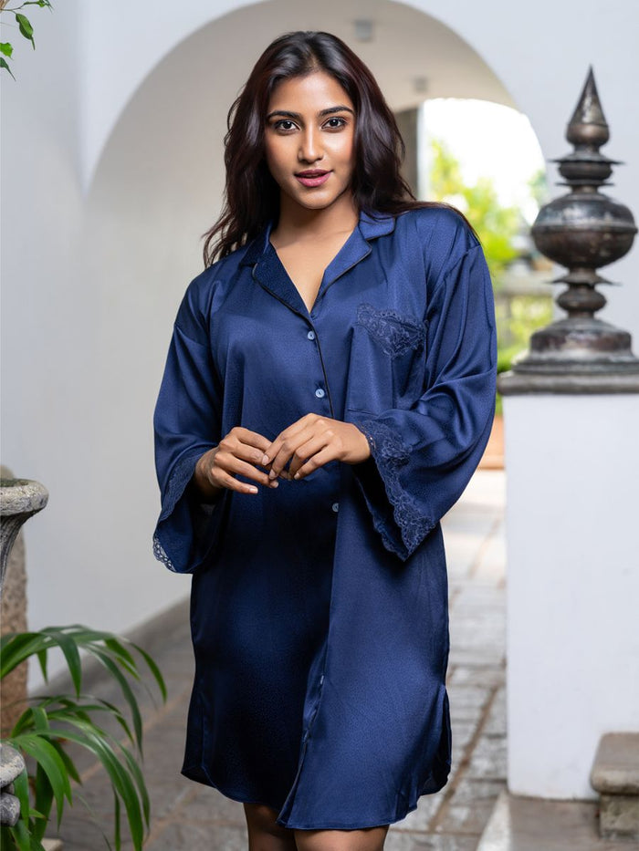 Woman wearing a blue satin nightshirt in an outdoor setting