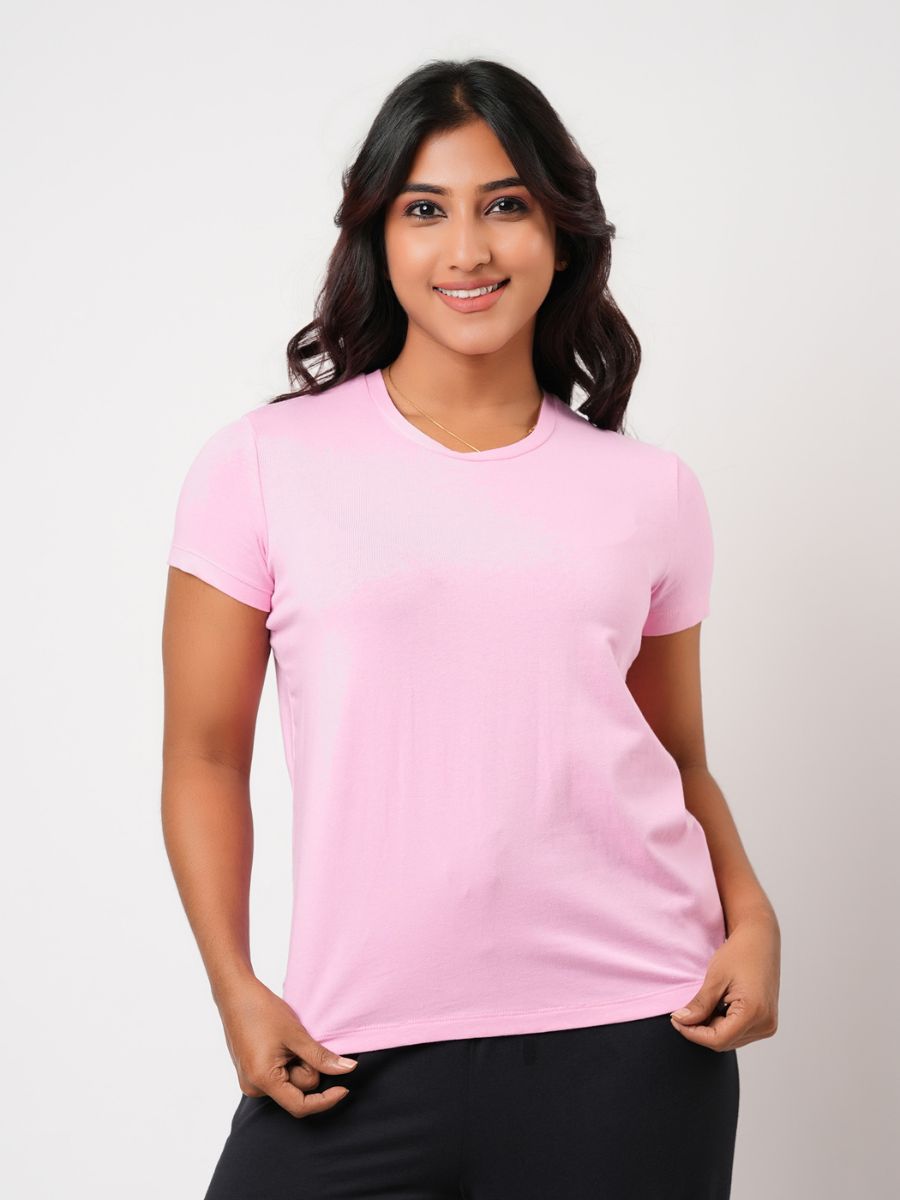 Woman wearing a pink t-shirt against a white background