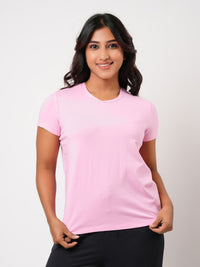 Woman wearing a pink t-shirt against a white background