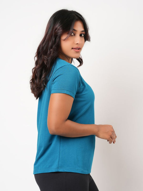 Woman wearing a blue shirt against a white background