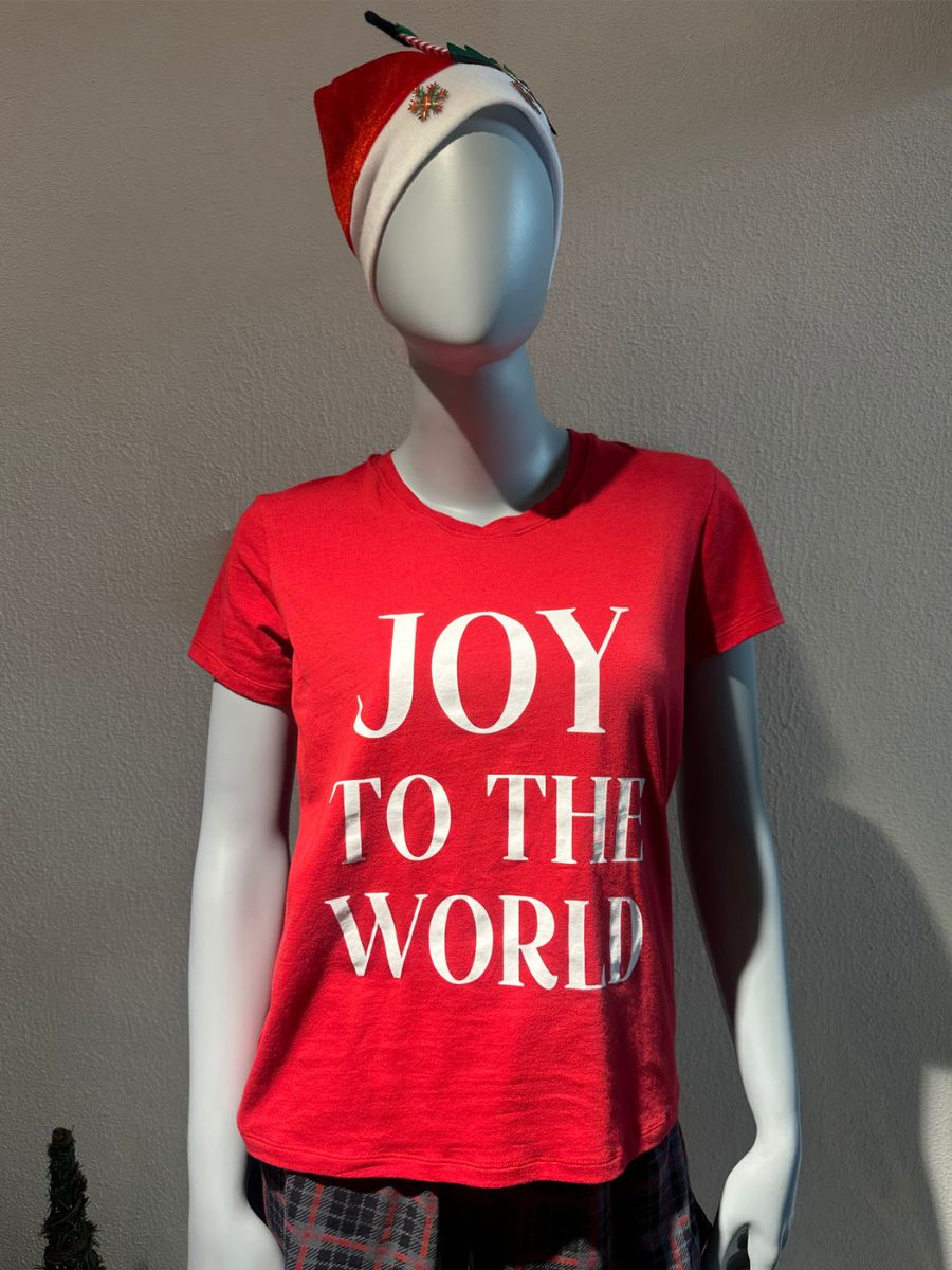 Mannequin wearing a red 'JOY TO THE WORLD' t-shirt and Santa hat against a plain background