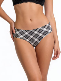 Person wearing a black and white checkered bikini bottom on a white background