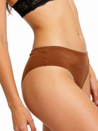 Brown underwear worn by a person on a white background