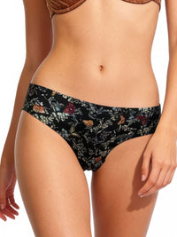 Floral-patterned bikini bottom worn by a person on a white background