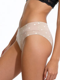 Beige polka dot underwear on a white background