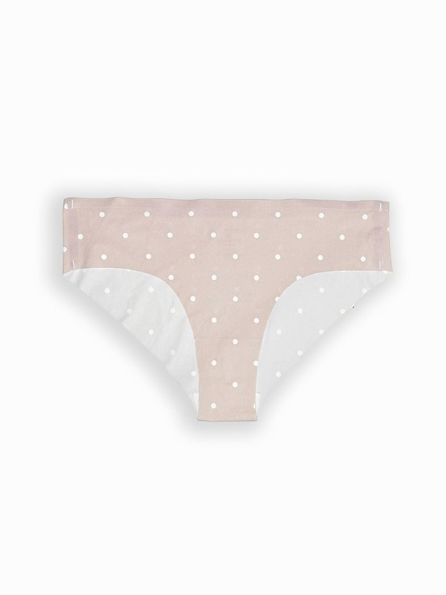 Pink polka dot underwear with white waistband on a light gray background