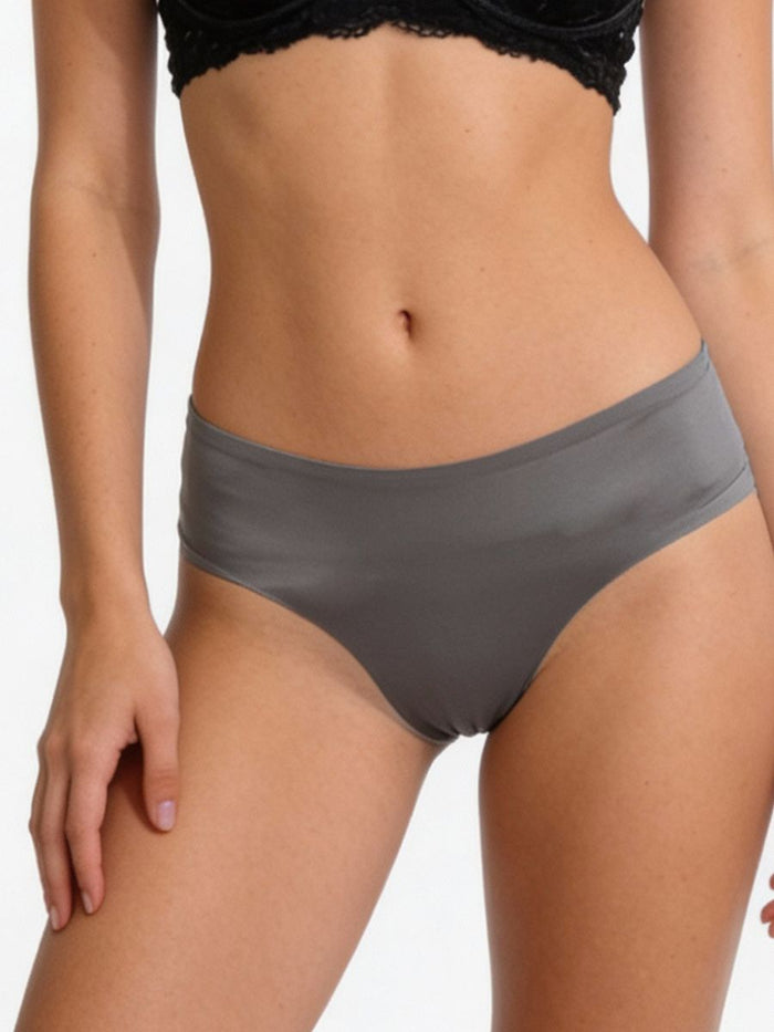 Person wearing gray underwear on a plain background