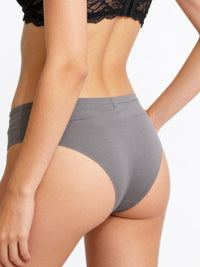 Gray underwear worn by a person on a white background