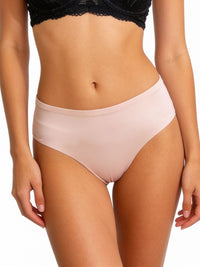 Person wearing a black lace bra and light pink underwear on a white background