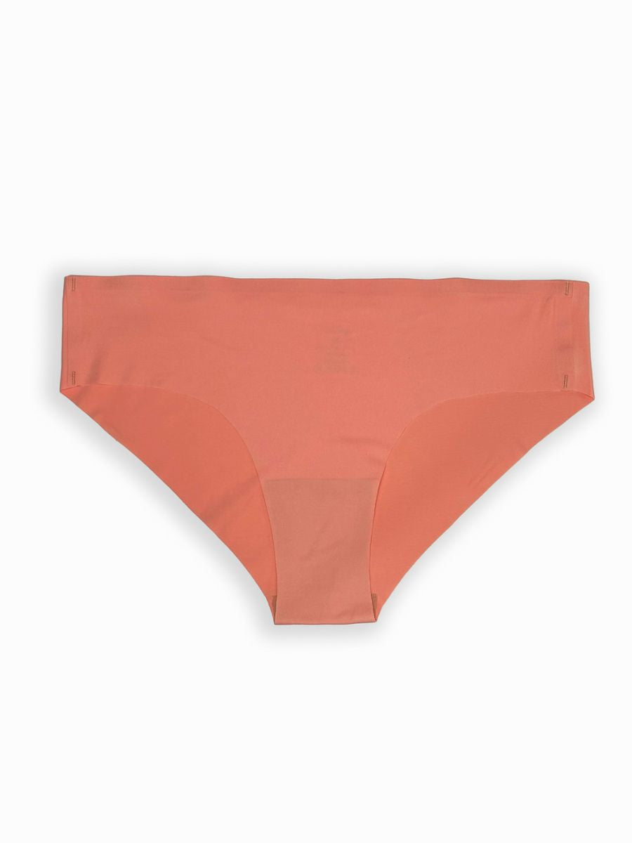 Coral-colored underwear on a white background
