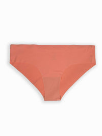 Coral-colored underwear on a white background