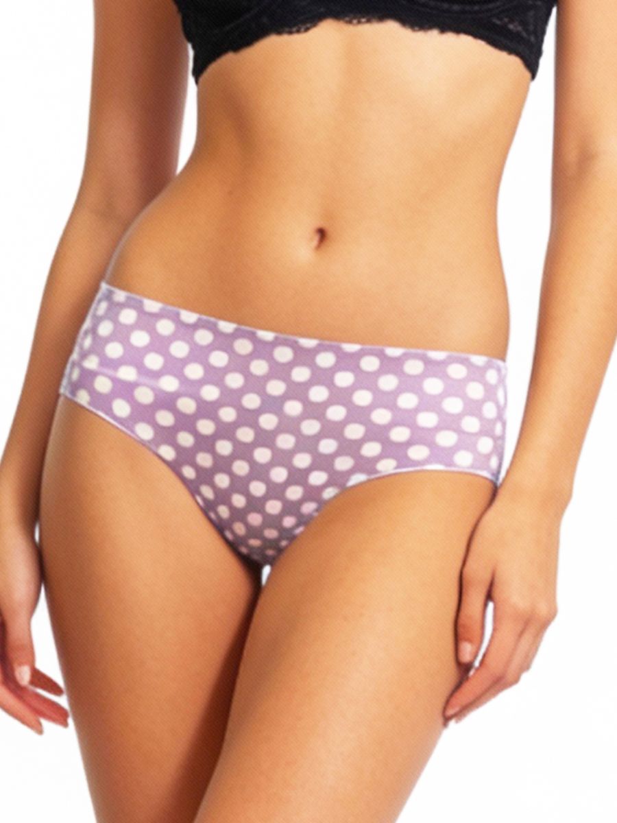 Purple polka dot underwear worn by a person on a white background